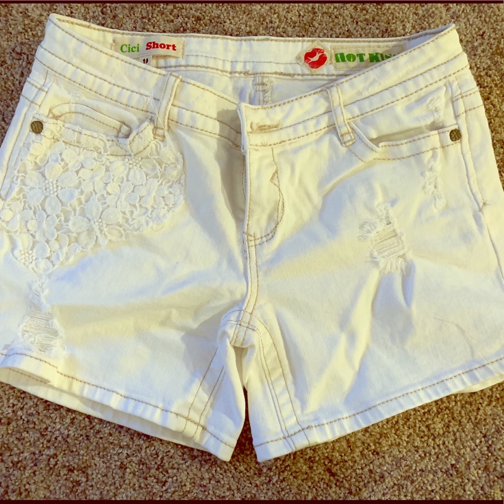 Size 9, white denim shorts with floral pattern